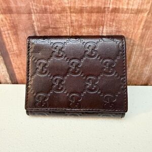 Gucci Dark Brown Embossed bifold wallet